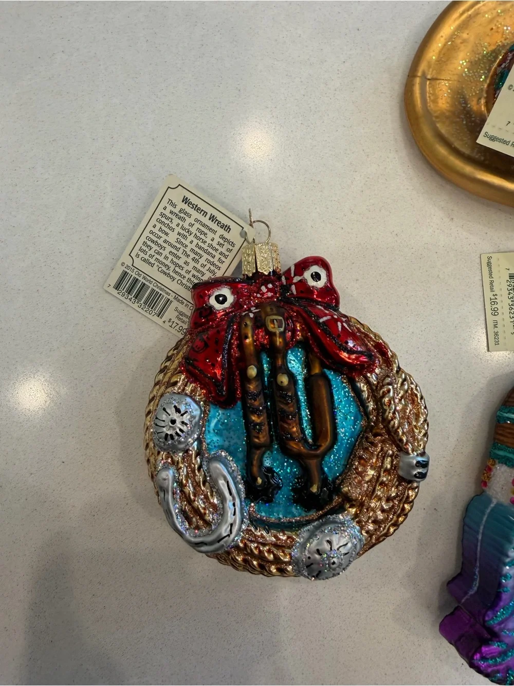 Lot of old world Christmas ornaments cowboy themed